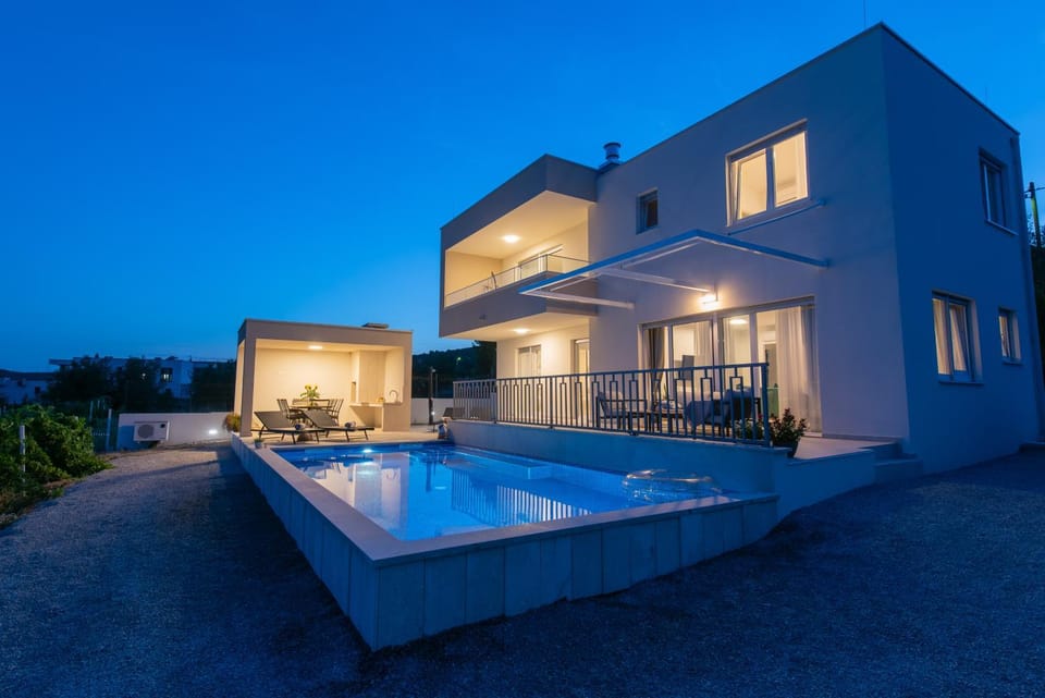 Property building, Patio, Night, Pool view, Swimming pool, sunbed
