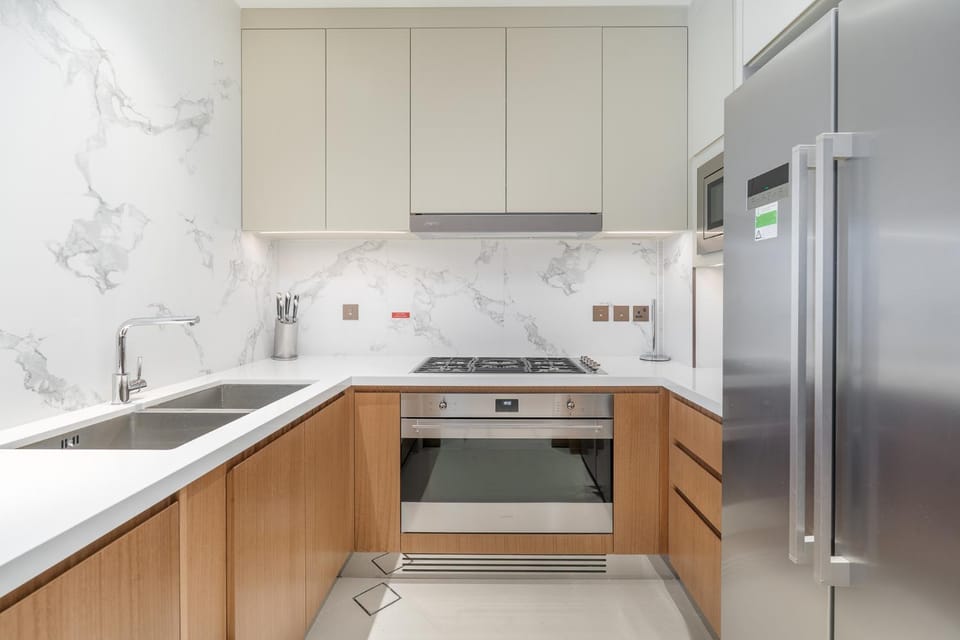 Kitchen or kitchenette, dishwasher, oven, stove