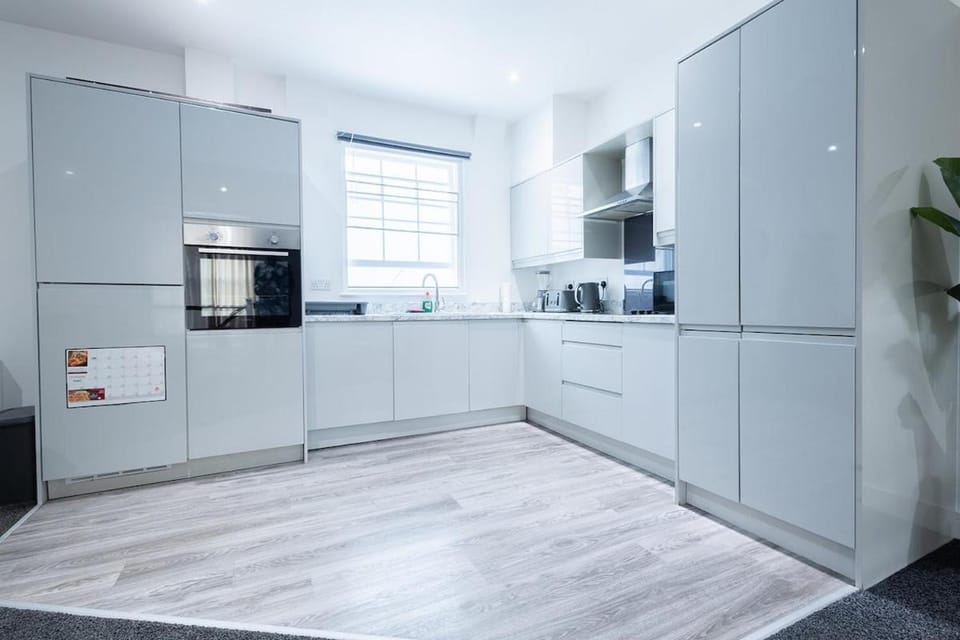 Kitchen or kitchenette, dishwasher, oven, stove