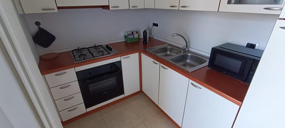 Kitchen or kitchenette, oven, stove