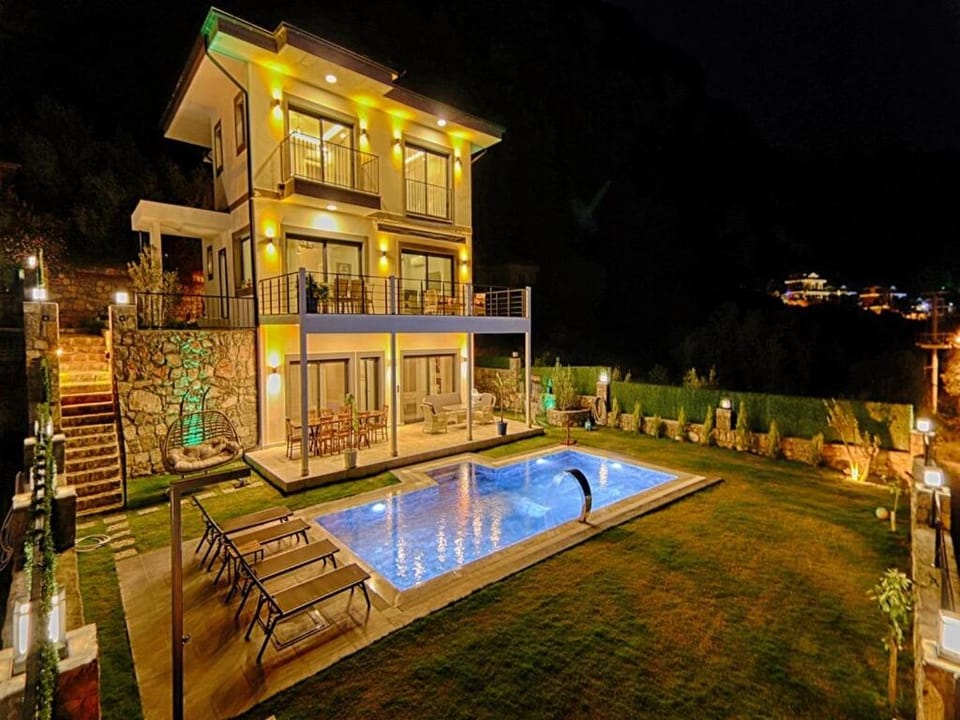 Property building, Patio, Night, Natural landscape, Garden, Garden view, Pool view, Swimming pool, sunbed