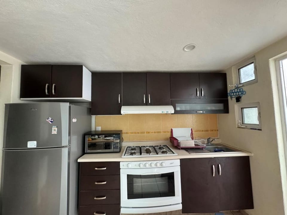 Kitchen or kitchenette, oven, toaster