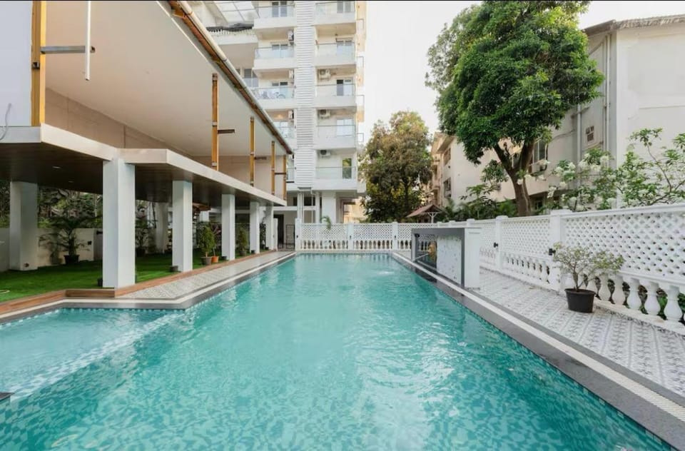 Palm View 1BHK with Pool & Café - Sazo Stays Apartment in Goa, India