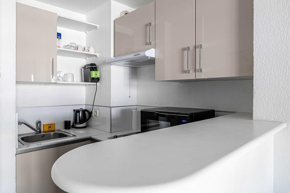 Kitchen or kitchenette, stove, toaster