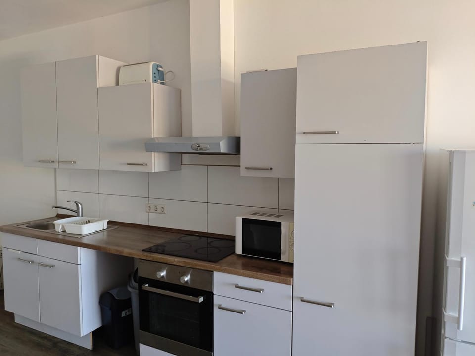 Kitchen or kitchenette, oven, stove