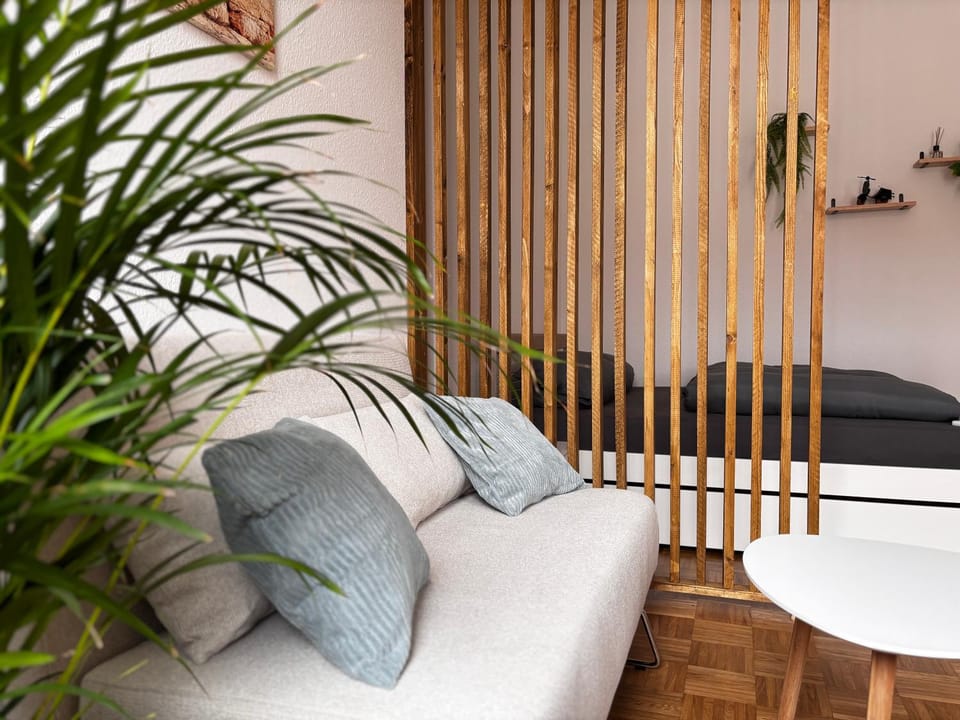 Bed, Living room, Seating area, Bedroom