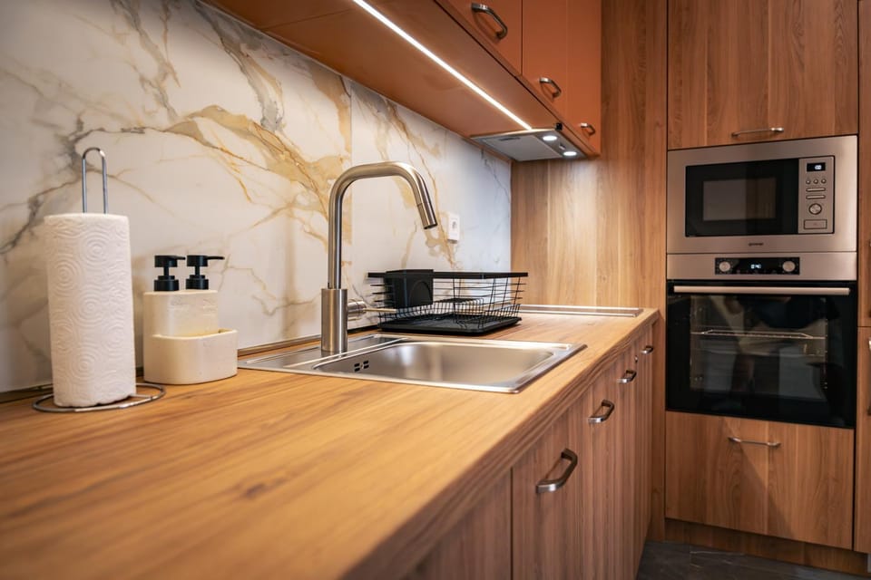 Kitchen or kitchenette, dishwasher, oven, stove