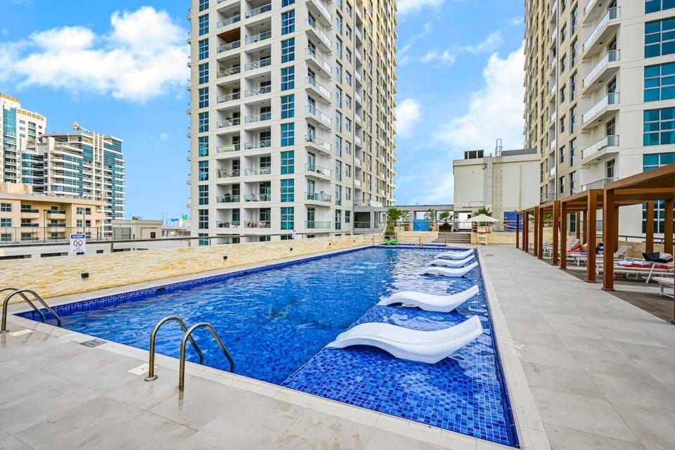 Property building, Patio, Day, City view, Pool view, Swimming pool, sunbed