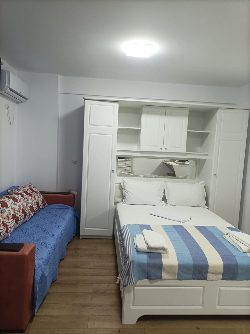Bed, wardrobe, air conditioner