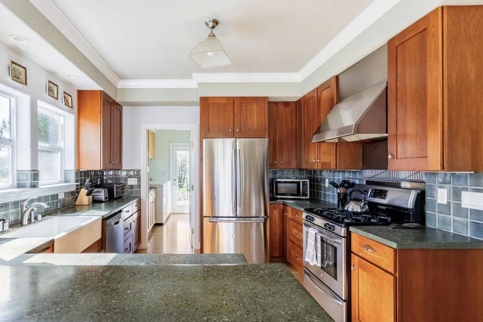 Kitchen or kitchenette, dishwasher, oven, stove, toaster, dryer