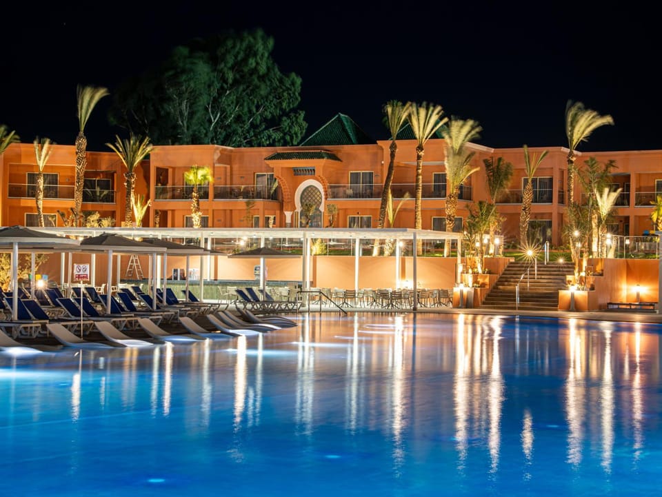 Property building, Night, Pool view, Swimming pool, Swimming pool, sunbed