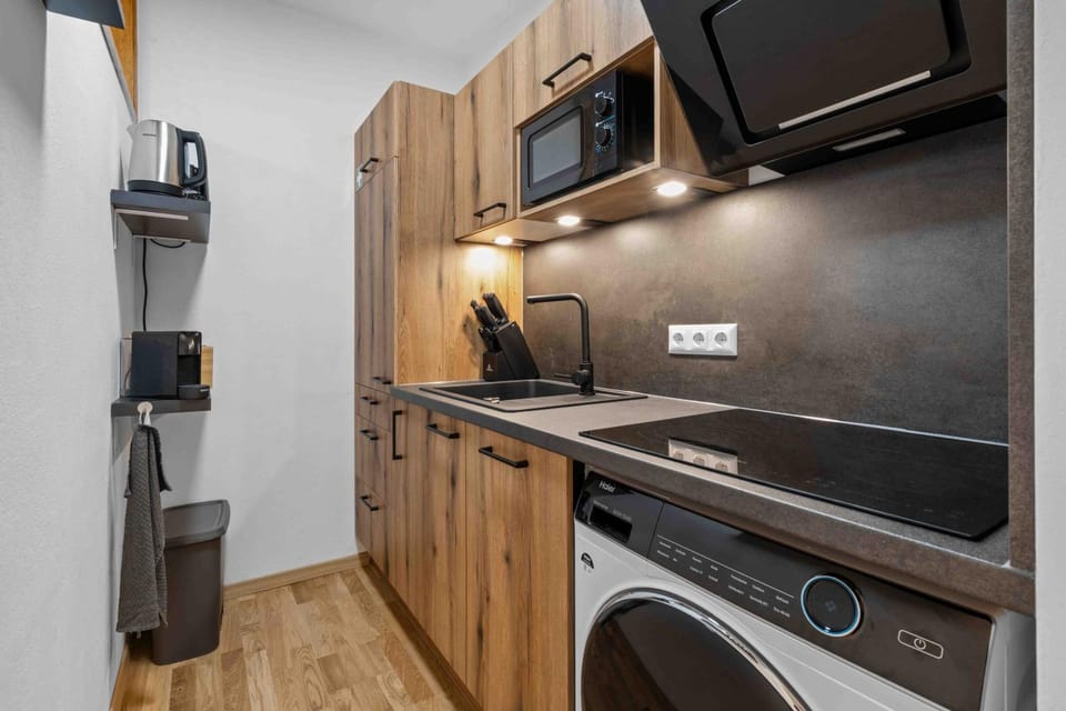 Kitchen or kitchenette, dishwasher, oven, stove, washing machine