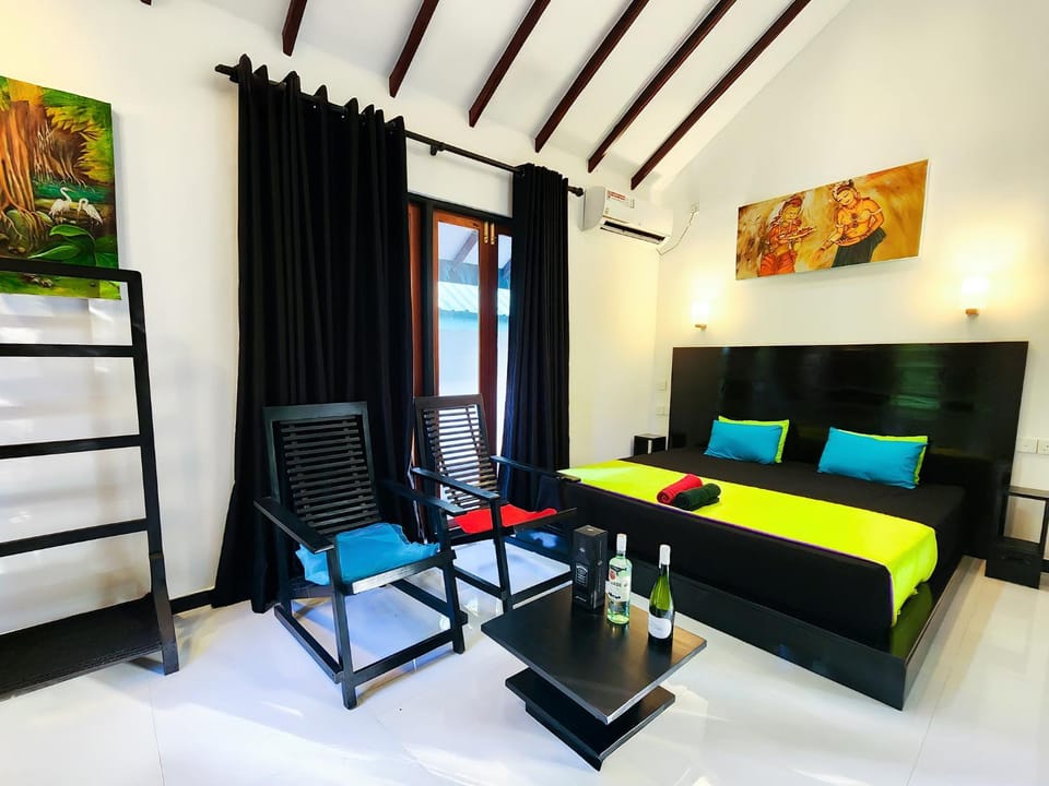 Bed, Living room, Seating area, Bedroom