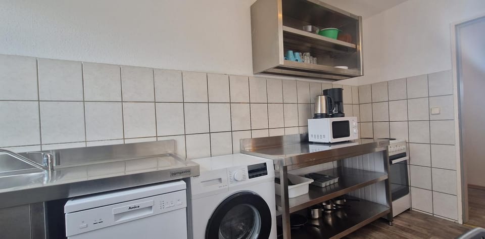Kitchen or kitchenette, dishwasher, oven, stove, washing machine