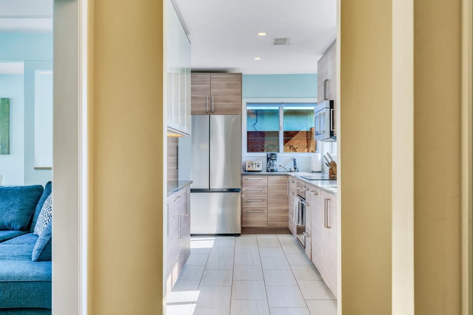 Kitchen or kitchenette, dishwasher, oven, stove