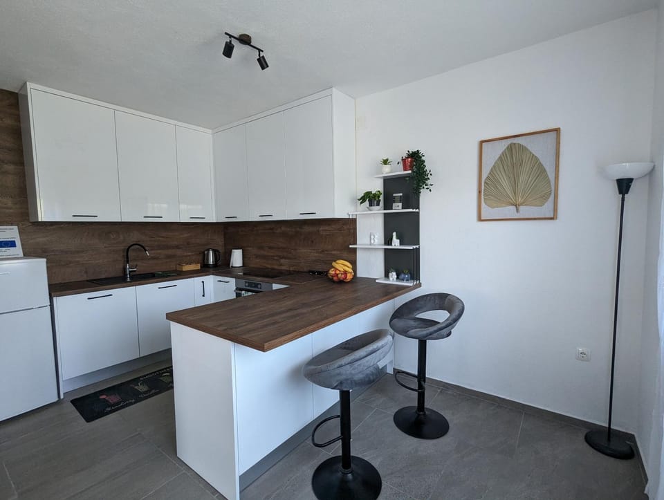 Kitchen or kitchenette, dishwasher, oven, stove, air conditioner