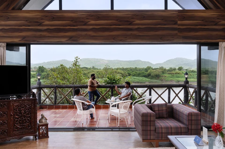 Patio, Communal lounge/ TV room, Day, People, Natural landscape, TV and multimedia, View (from property/room), Balcony/Terrace, Living room, Seating area, Evening entertainment, Mountain view, River view, group of guests