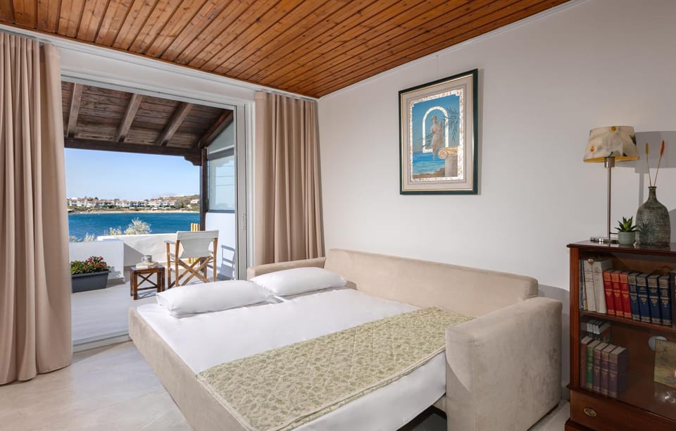Bed, Natural landscape, Library, View (from property/room), Living room, Seating area, Sea view