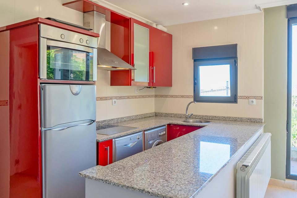 Kitchen or kitchenette, dishwasher, oven, stove