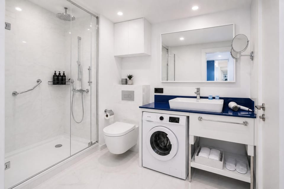 Shower, Toilet, Bathroom, towels, washing machine, dryer
