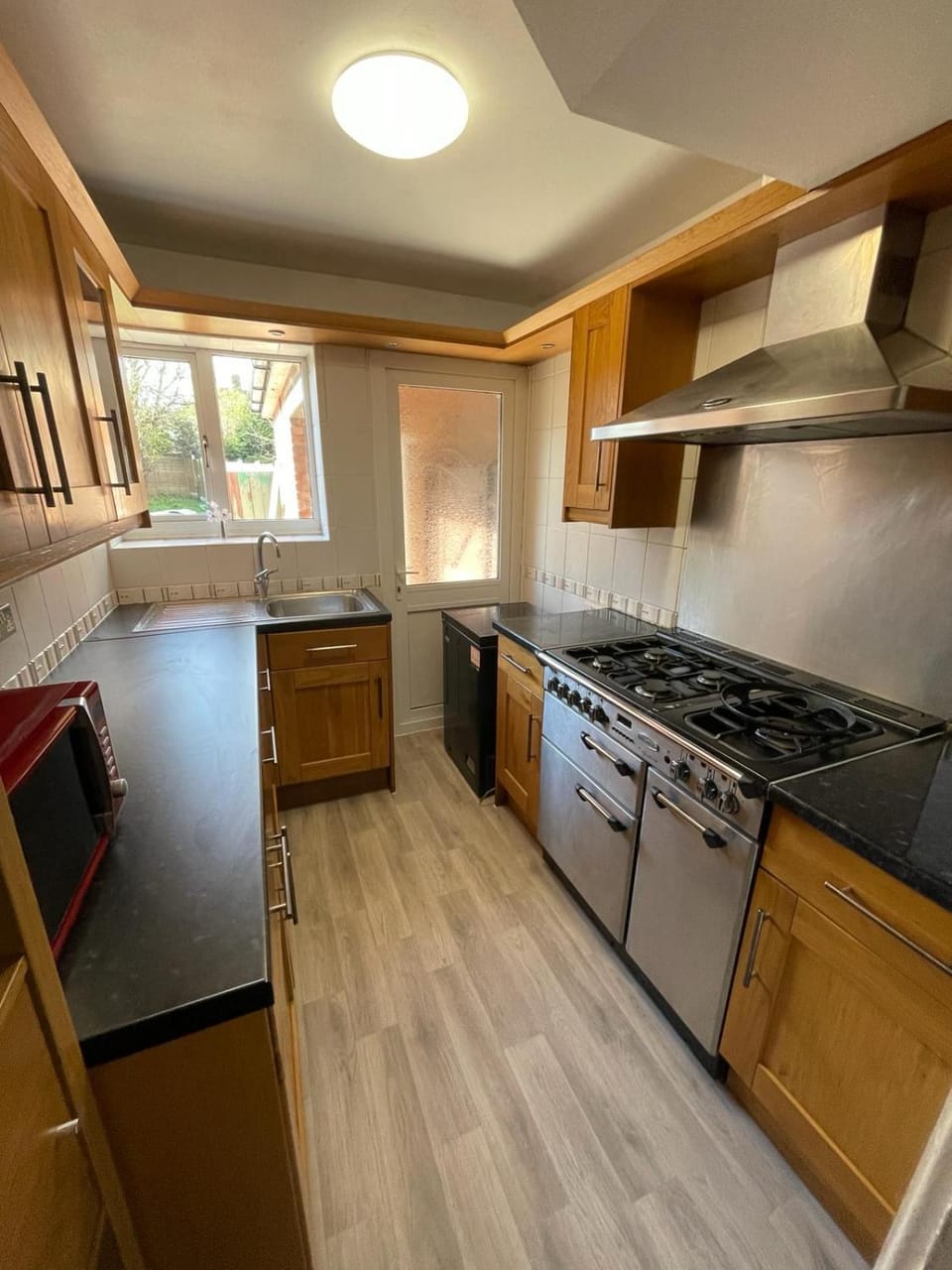 Kitchen or kitchenette, dishwasher, oven, stove