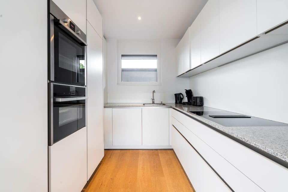 Kitchen or kitchenette, dishwasher, oven, stove, toaster