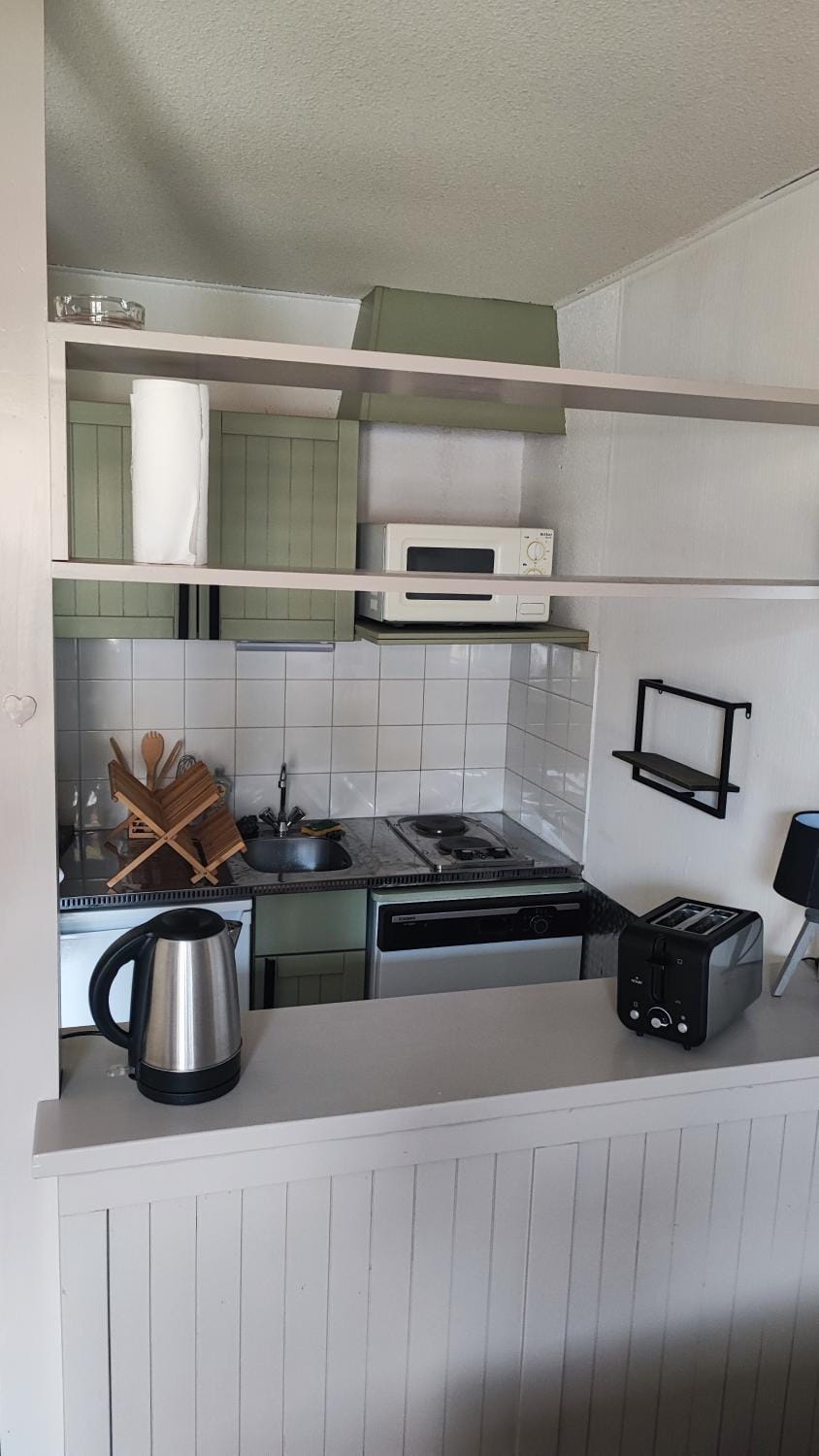 Kitchen or kitchenette, stove, toaster