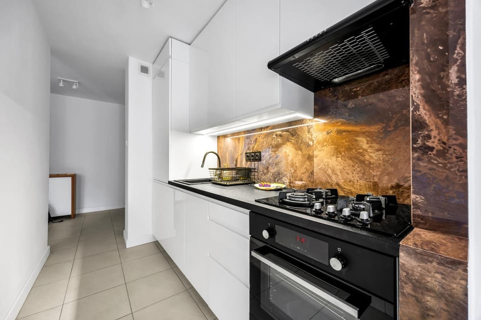 Kitchen or kitchenette, dishwasher, oven, stove