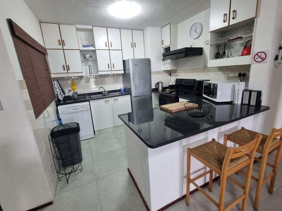 Kitchen or kitchenette, dishwasher, oven, stove, toaster
