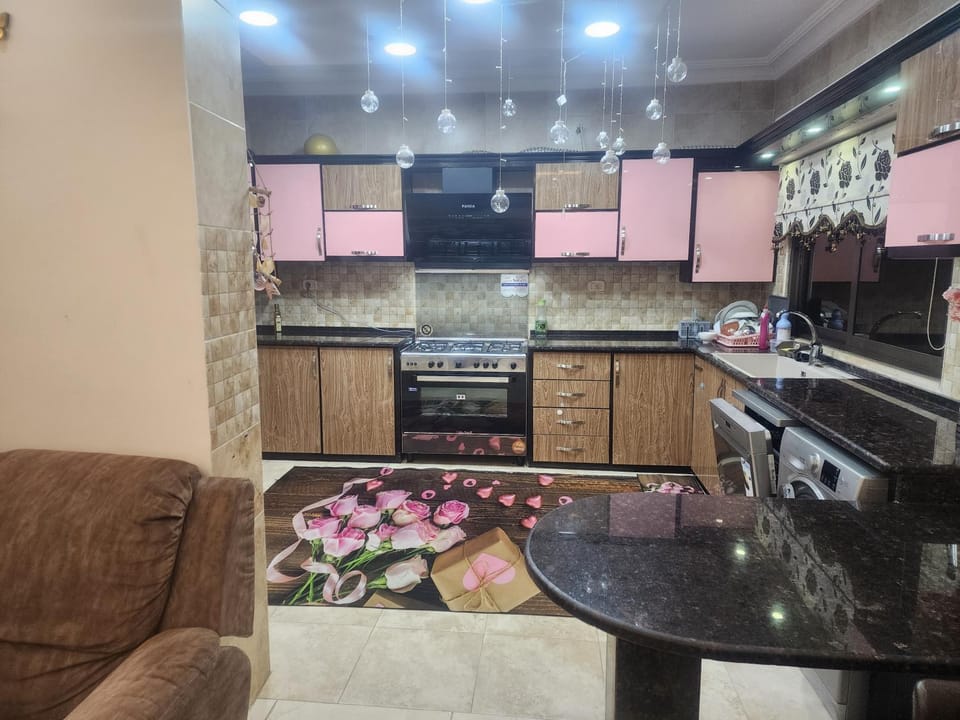 Kitchen or kitchenette, dishwasher, oven, stove