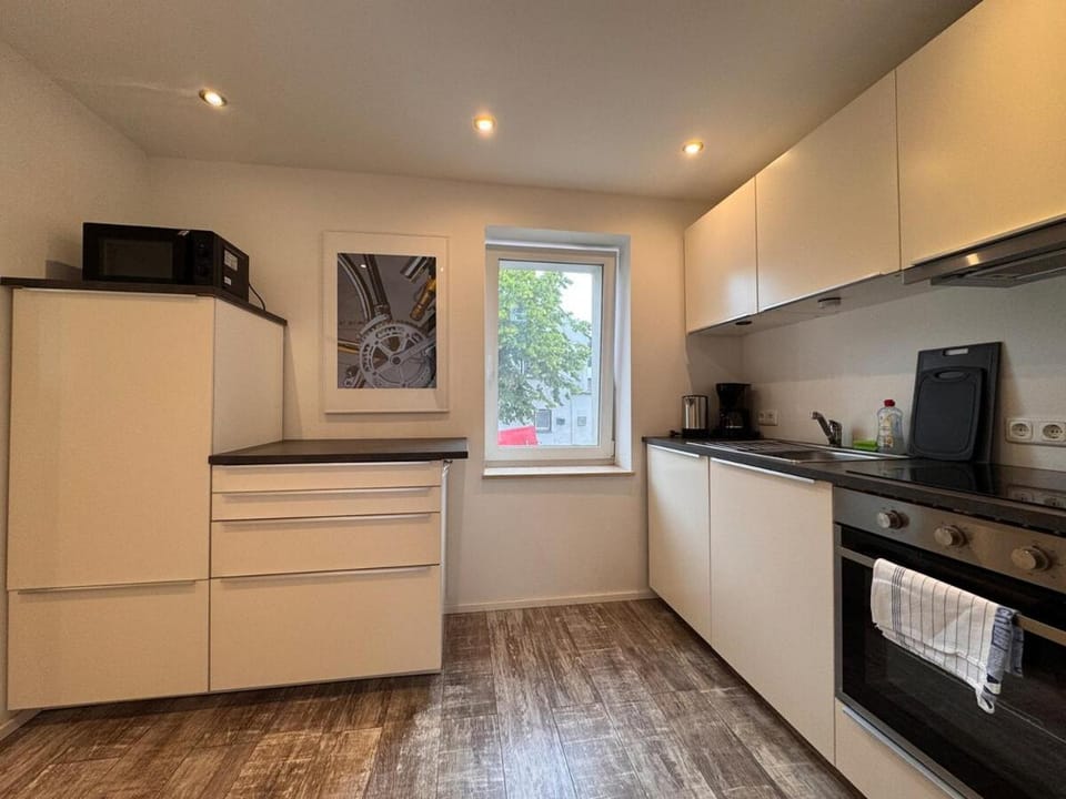 Kitchen or kitchenette, dishwasher, oven, stove, toaster