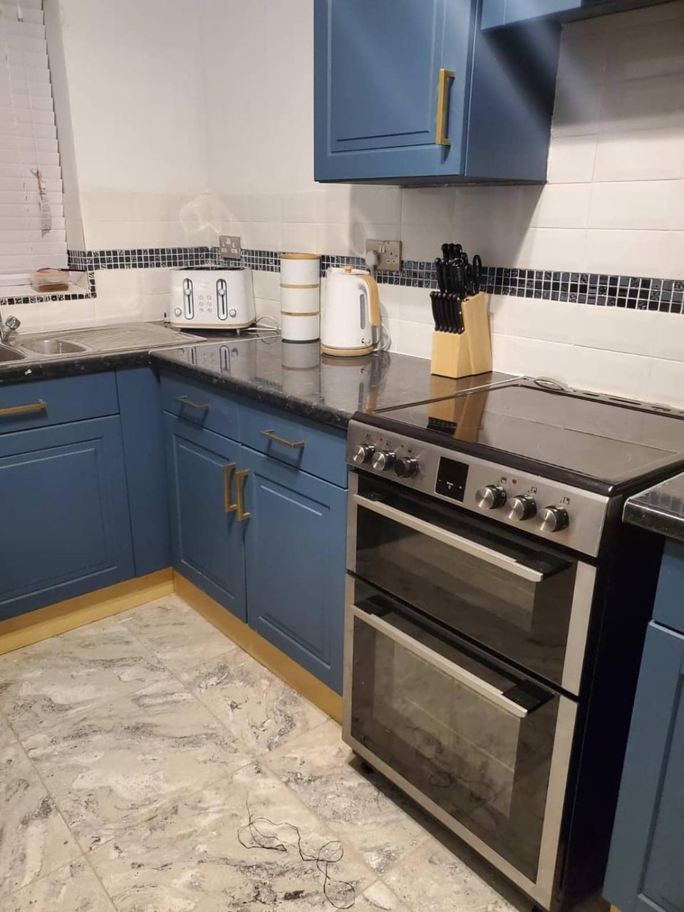 Kitchen or kitchenette, stove, toaster