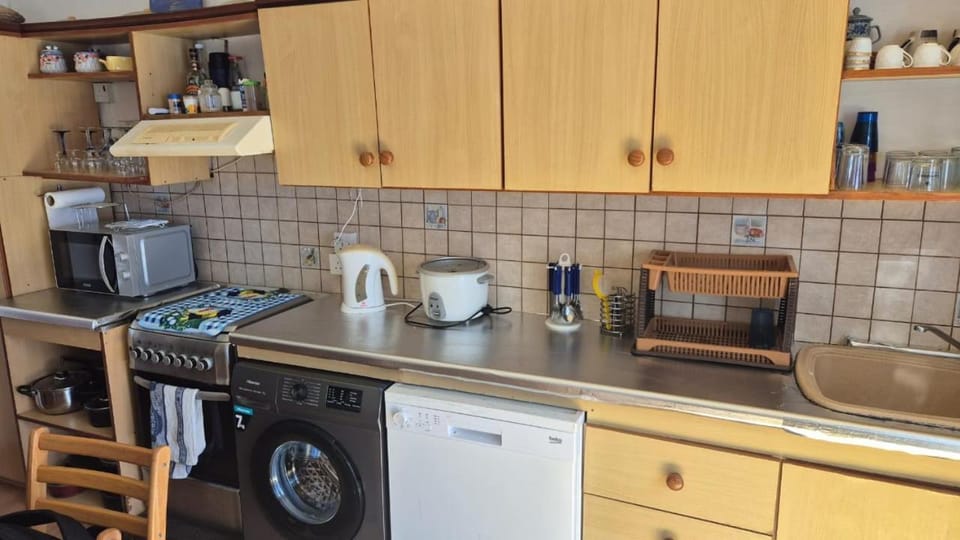 Kitchen or kitchenette, dishwasher, oven, stove, toaster