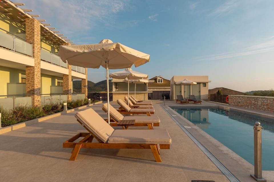 Property building, Patio, Pool view, Swimming pool, sunbed
