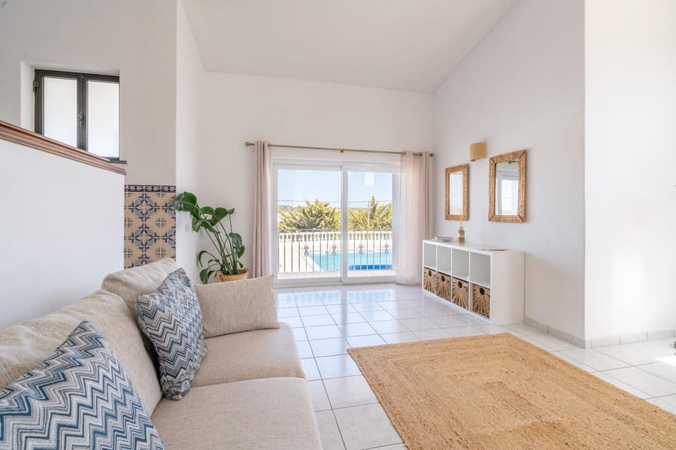 Living room, Seating area, Pool view