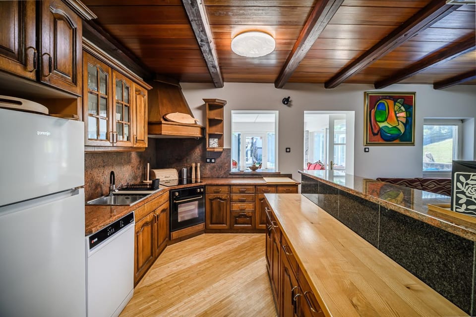 Kitchen or kitchenette, dishwasher, oven, stove