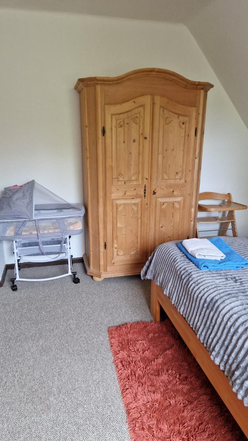 Bedroom, cot, wardrobe