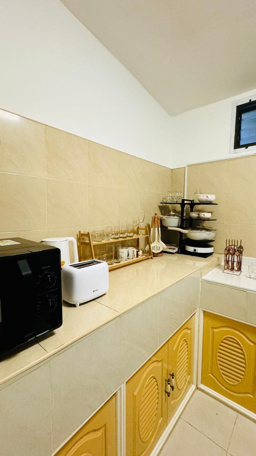 Kitchen or kitchenette, stove, toaster