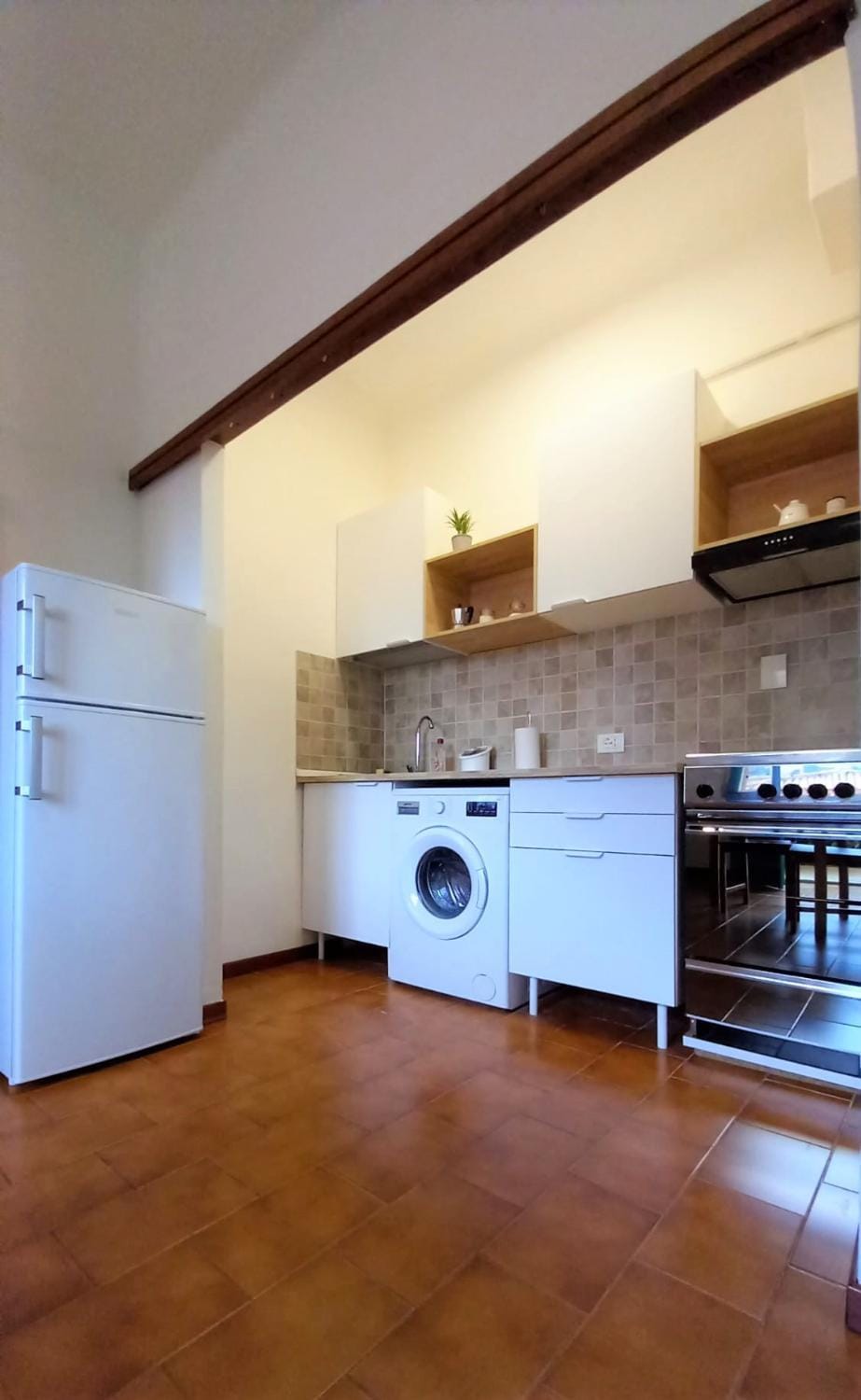 Kitchen or kitchenette, oven, stove, washing machine