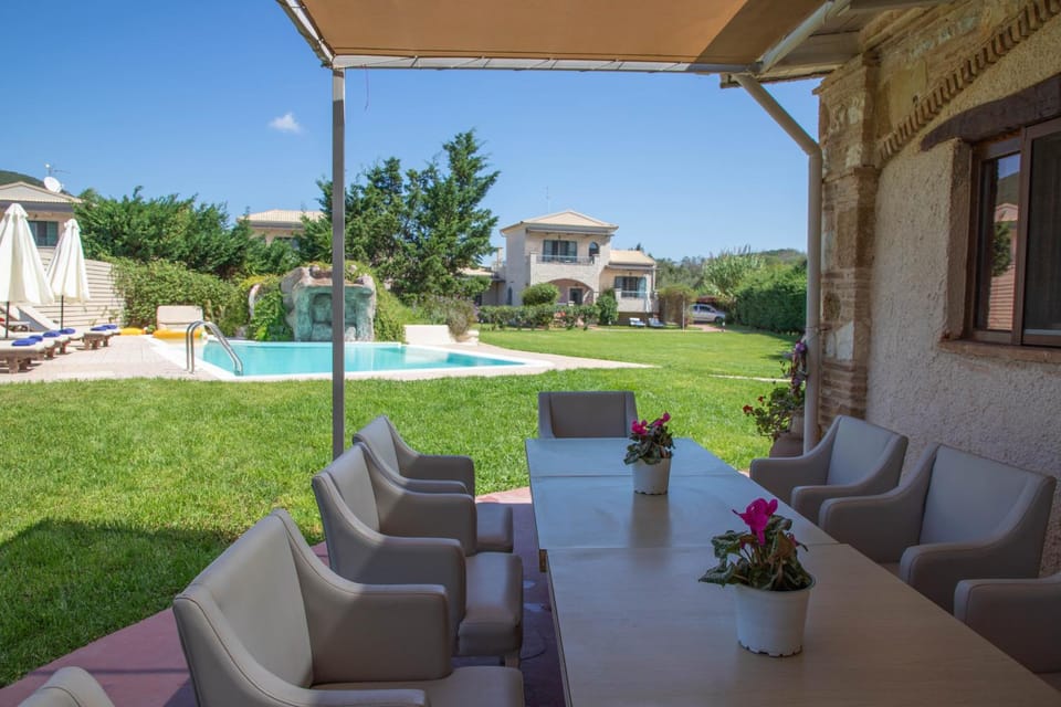 Property building, Garden, Living room, Seating area, Garden view, Pool view, Swimming pool