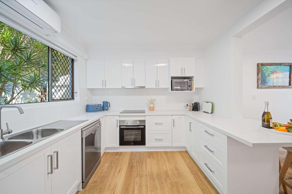 Kitchen or kitchenette, dishwasher, oven, stove, toaster