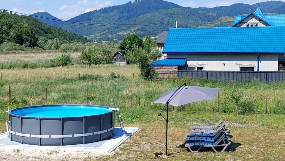 Property building, Natural landscape, Pool view, Swimming pool, sunbed