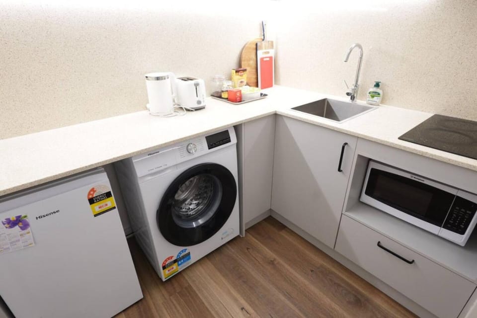 Kitchen or kitchenette, washing machine