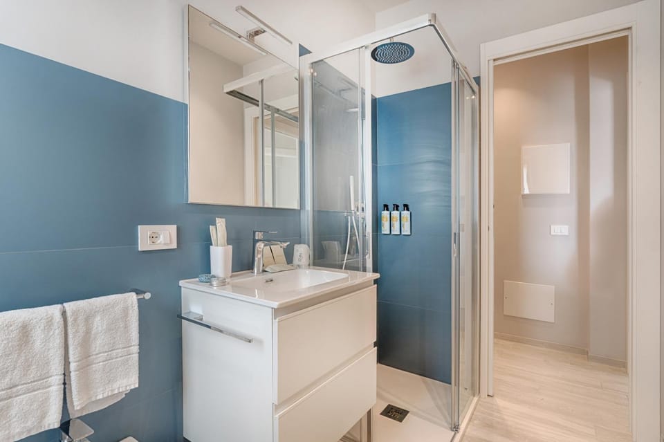 Shower, Bathroom, hair dryier, towels