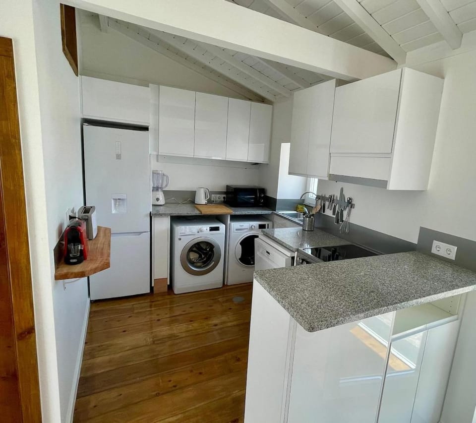 Kitchen or kitchenette, oven, stove, washing machine, dryer