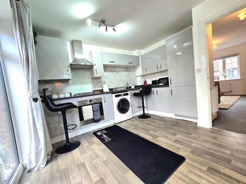 Kitchen or kitchenette, oven, stove, toaster, washing machine, dryer