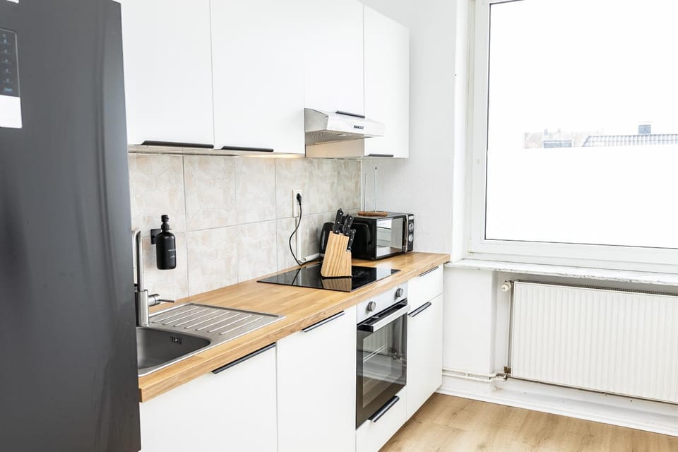 Kitchen or kitchenette, dishwasher, oven, stove, toaster