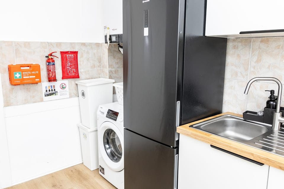 Kitchen or kitchenette, dishwasher, oven, stove, washing machine