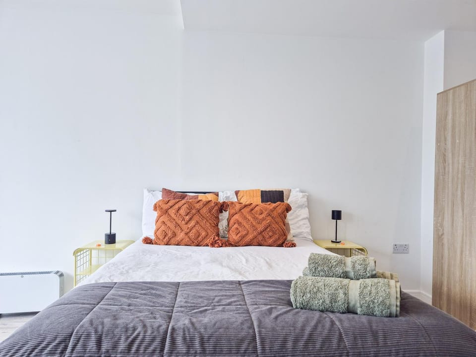 Bed, towels, wardrobe
