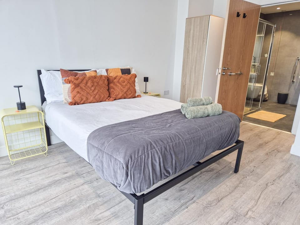 Bed, Bathroom, towels, wardrobe